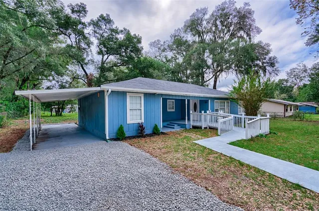 a view of a house with a yard patio and a patio