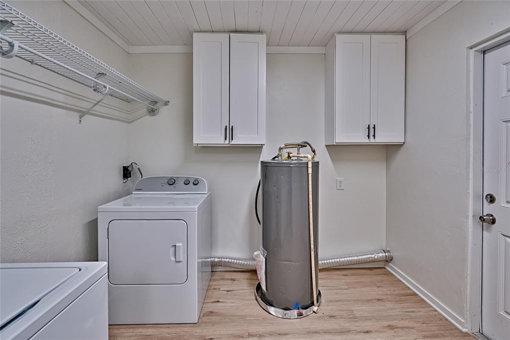 209 Southeast 47th Street Gainesville, FL 32641 - Photo 11 of 29 a view of storage and utility room with washer and dryer