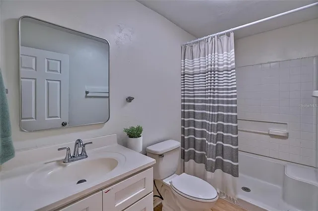 a bedroom with a bed and a closet