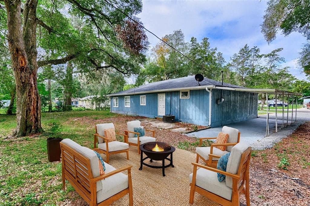 209 Southeast 47th Street Gainesville, FL 32641 - Photo 21 of 29 a view of backyard with seating space and wooden fence