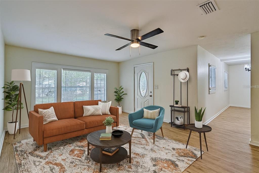 209 Southeast 47th Street Gainesville, FL 32641 - Photo 4 of 29 a living room with furniture and a window