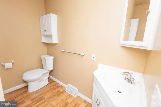 a bathroom with a sink toilet and vanity