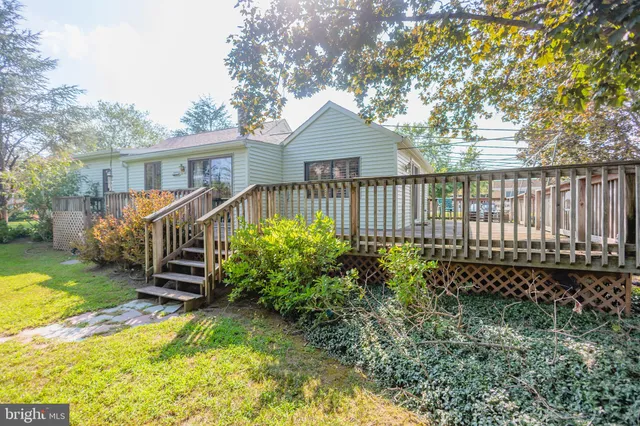 a view of a house with wooden fence