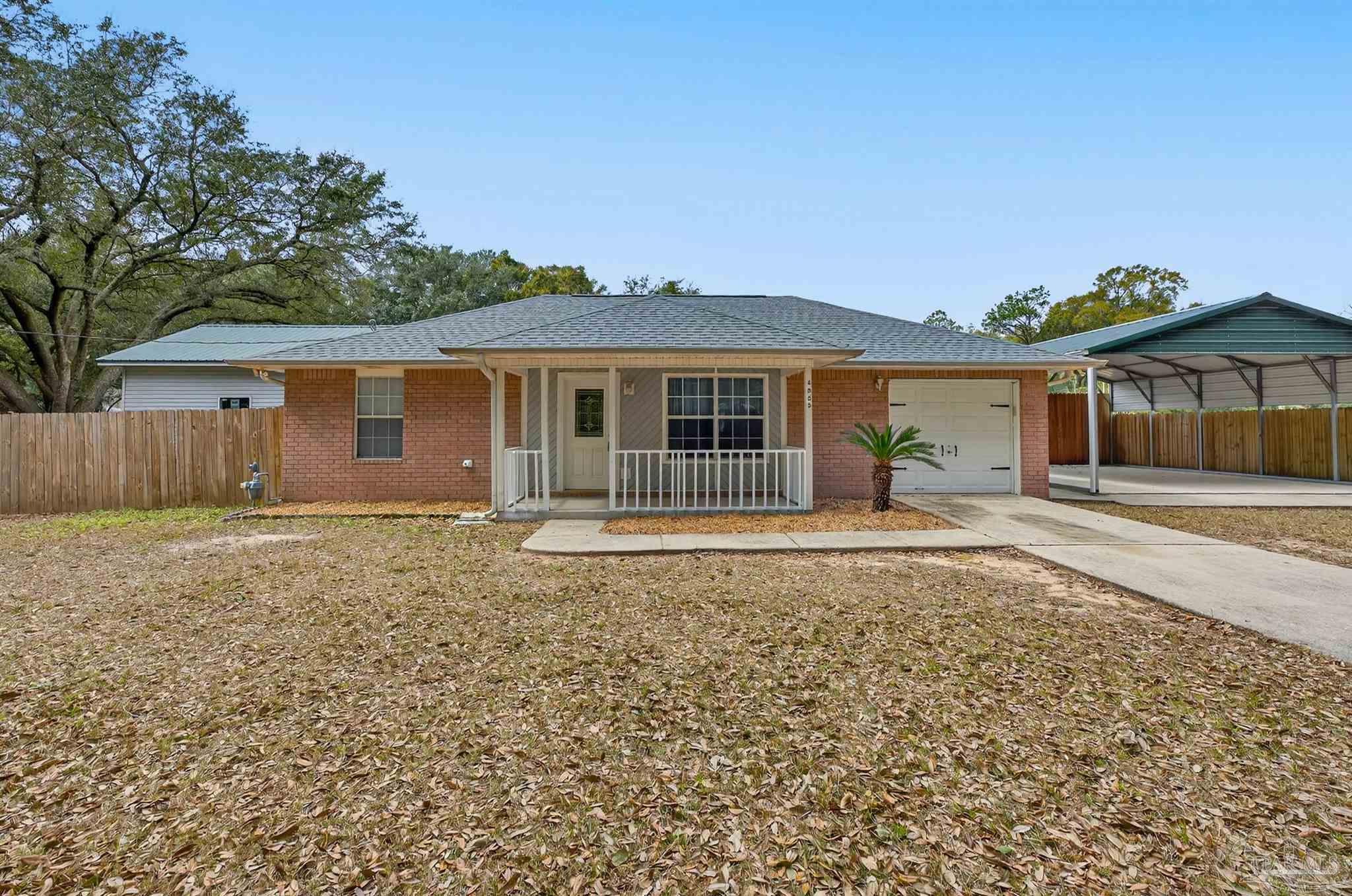 4885 Mayo Circle Pace, FL 32571 - Photo 1 of 44 front view of a house with a yard