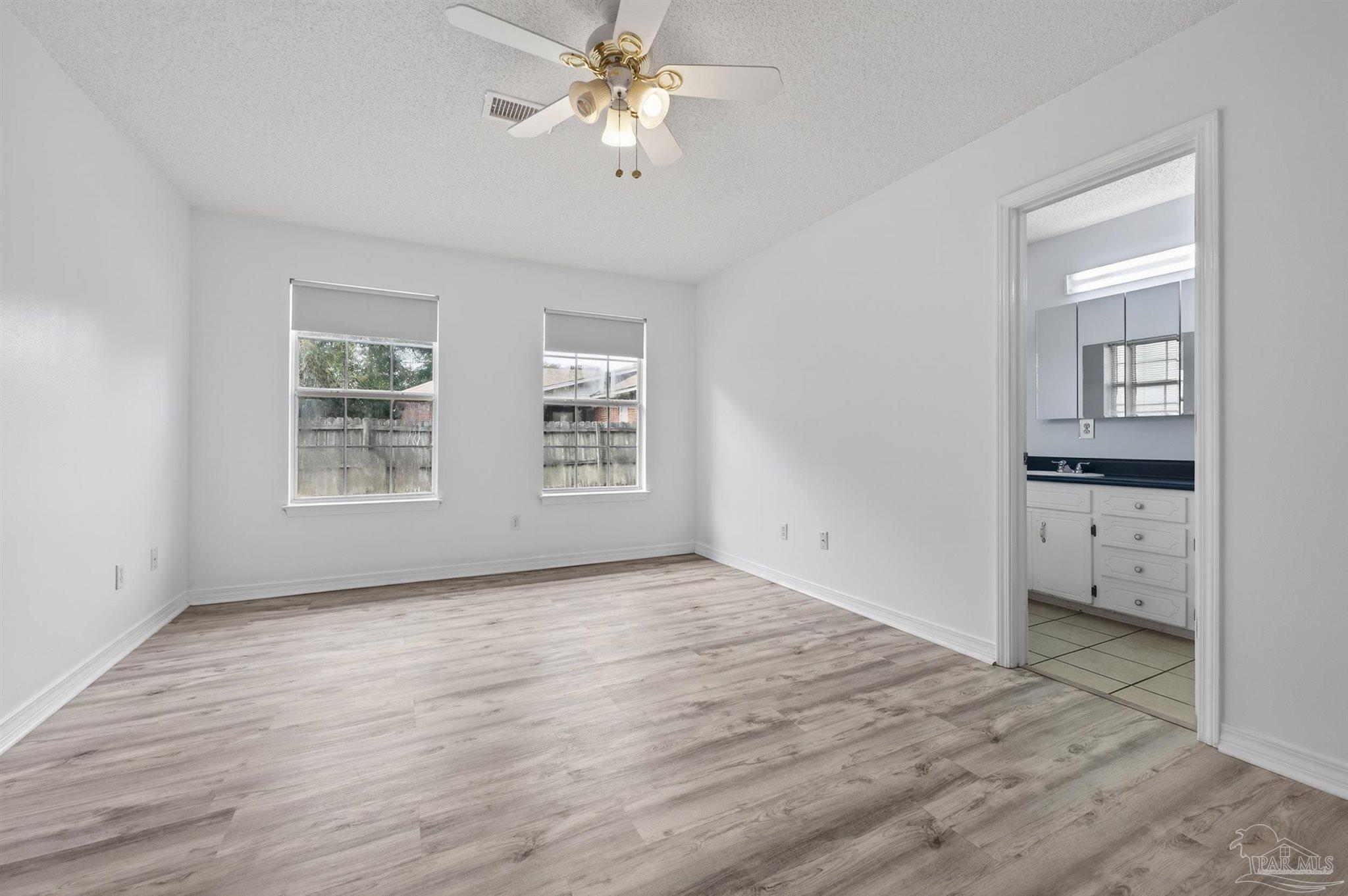 4885 Mayo Circle Pace, FL 32571 - Photo 18 of 44 a view of an empty room with a window
