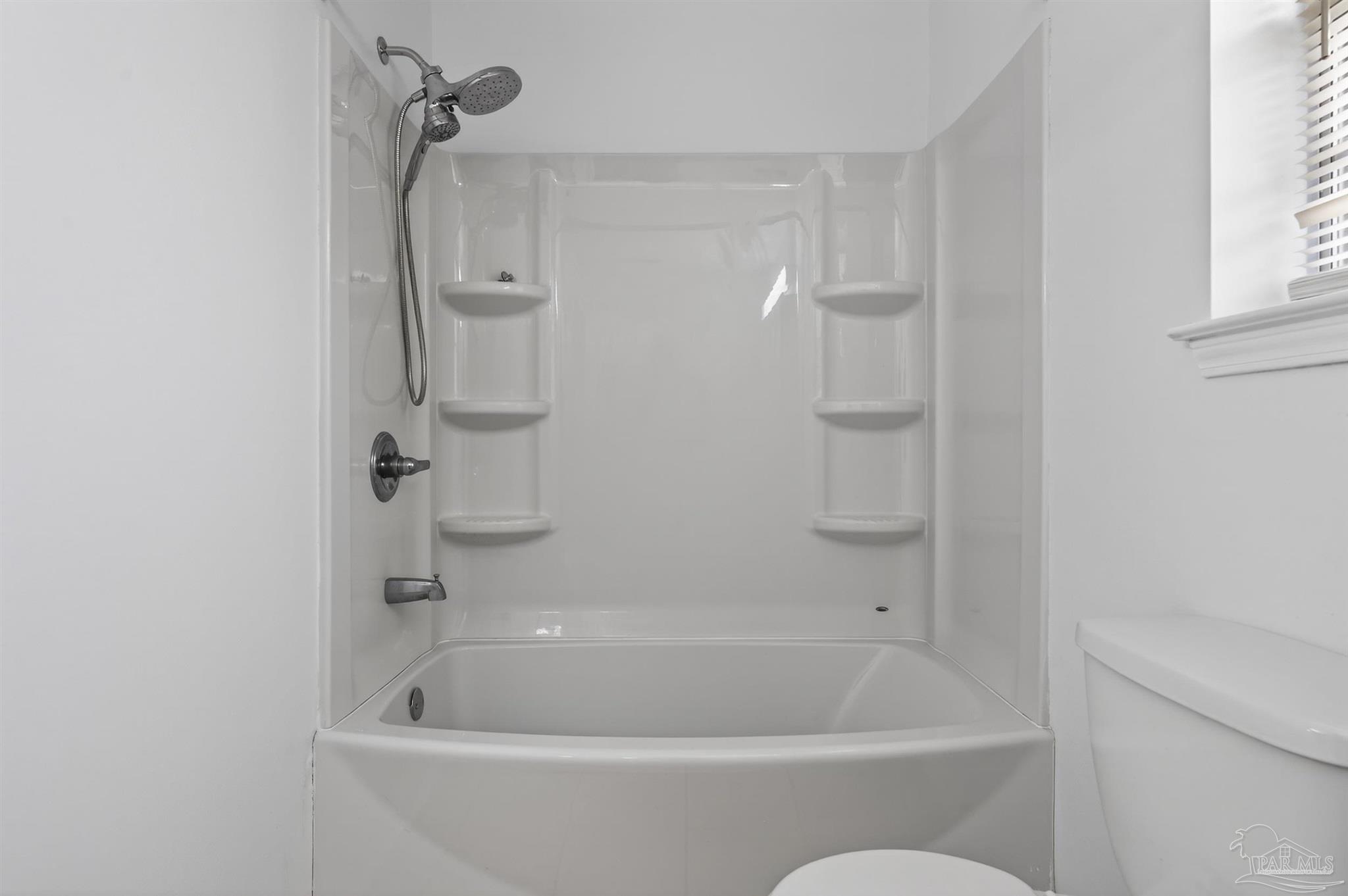 4885 Mayo Circle Pace, FL 32571 - Photo 21 of 44 a white bath tub sitting next to a white sink