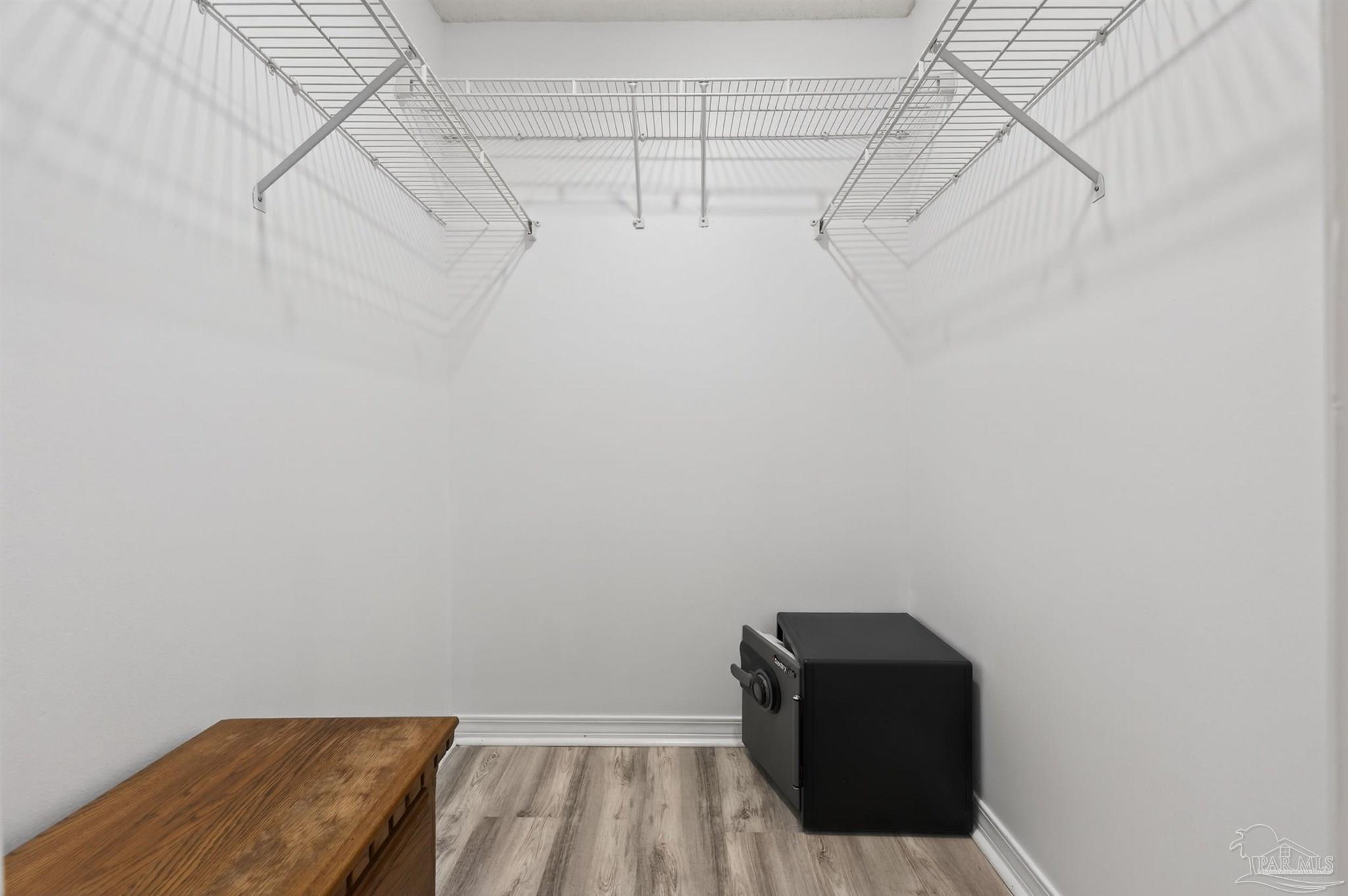 4885 Mayo Circle Pace, FL 32571 - Photo 22 of 44 a view of a room with racks on the wall