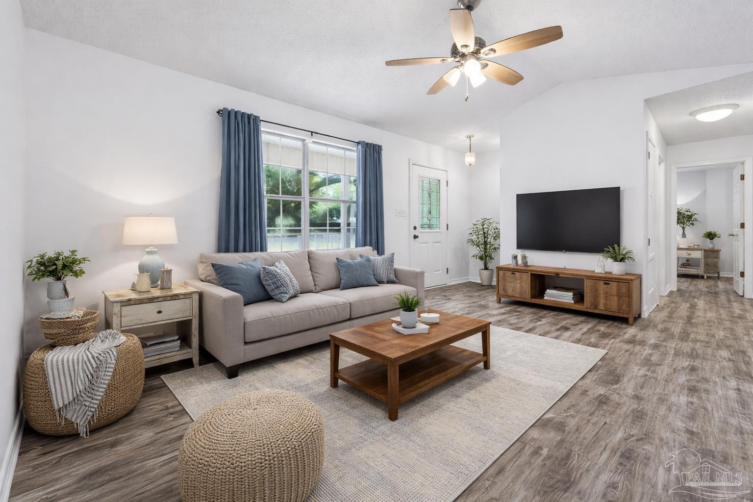 4885 Mayo Circle Pace, FL 32571 - Photo 4 of 44 a living room with furniture and a flat screen tv