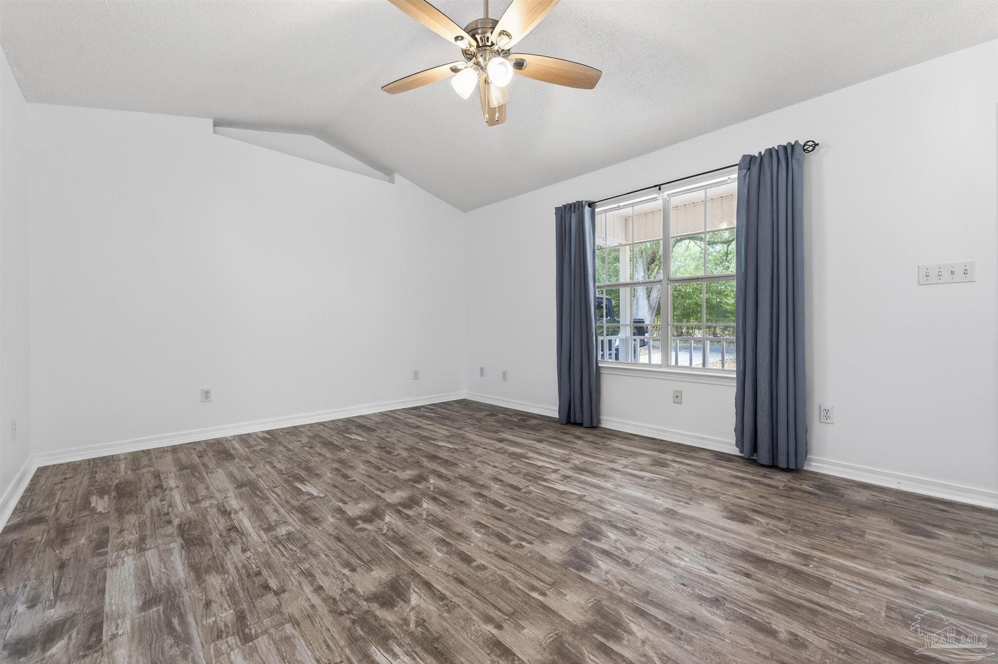 4885 Mayo Circle Pace, FL 32571 - Photo 7 of 44 a view of an empty room and window