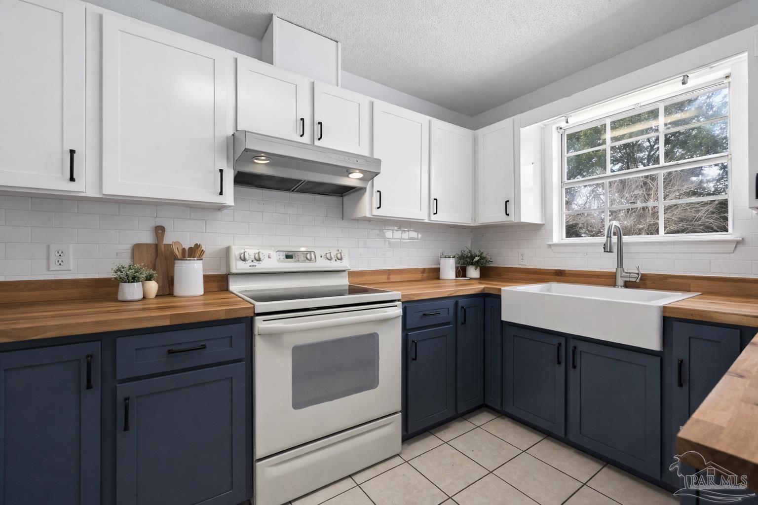 4885 Mayo Circle Pace, FL 32571 - Photo 10 of 44 a kitchen with stainless steel appliances granite countertop a sink stove and cabinets