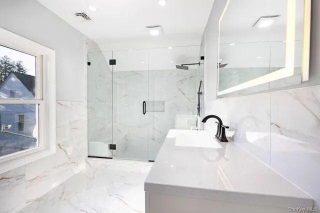 a bathroom with a sink and a shower