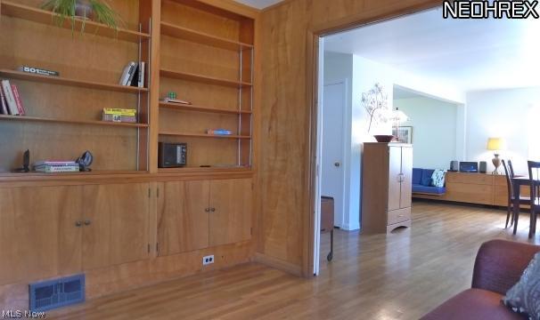 16406 Fernway Road Cleveland, OH 44120 - Photo 8 of 21 Built in book shelves in Family Room looking into Dining Room/Living Room