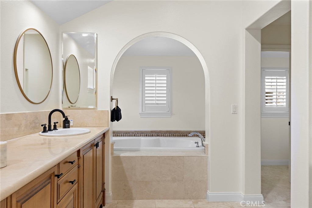 3 Tranquility Place Ladera Ranch, CA 92694 - Photo 28 of 63 a bathroom with a double vanity sink and a mirror