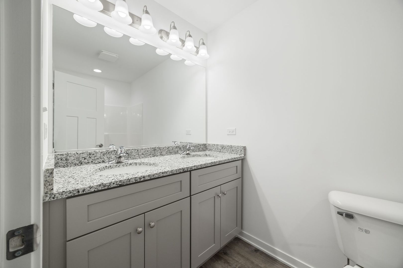 1236 Gillespie Lane Yorkville, IL 60560 - Photo 16 of 20 a bathroom with a granite countertop sink a toilet and a mirror