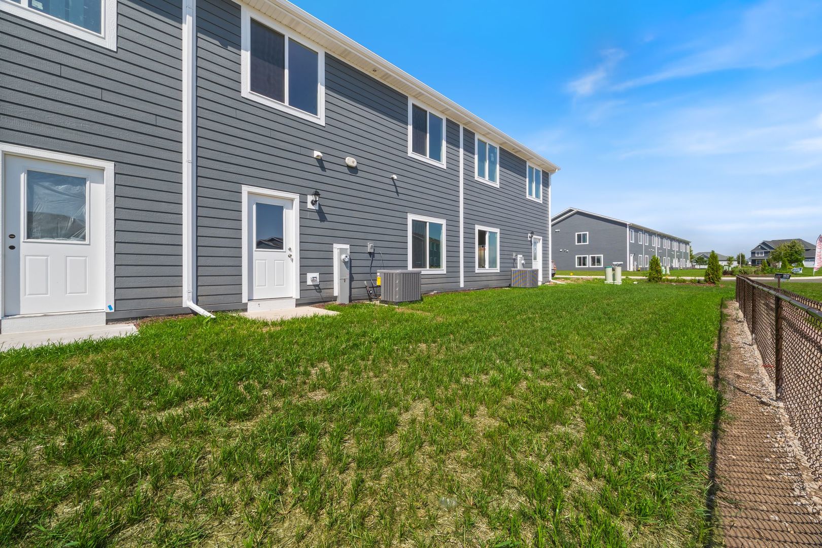 1236 Gillespie Lane Yorkville, IL 60560 - Photo 20 of 20 a brick building with a yard in front of it