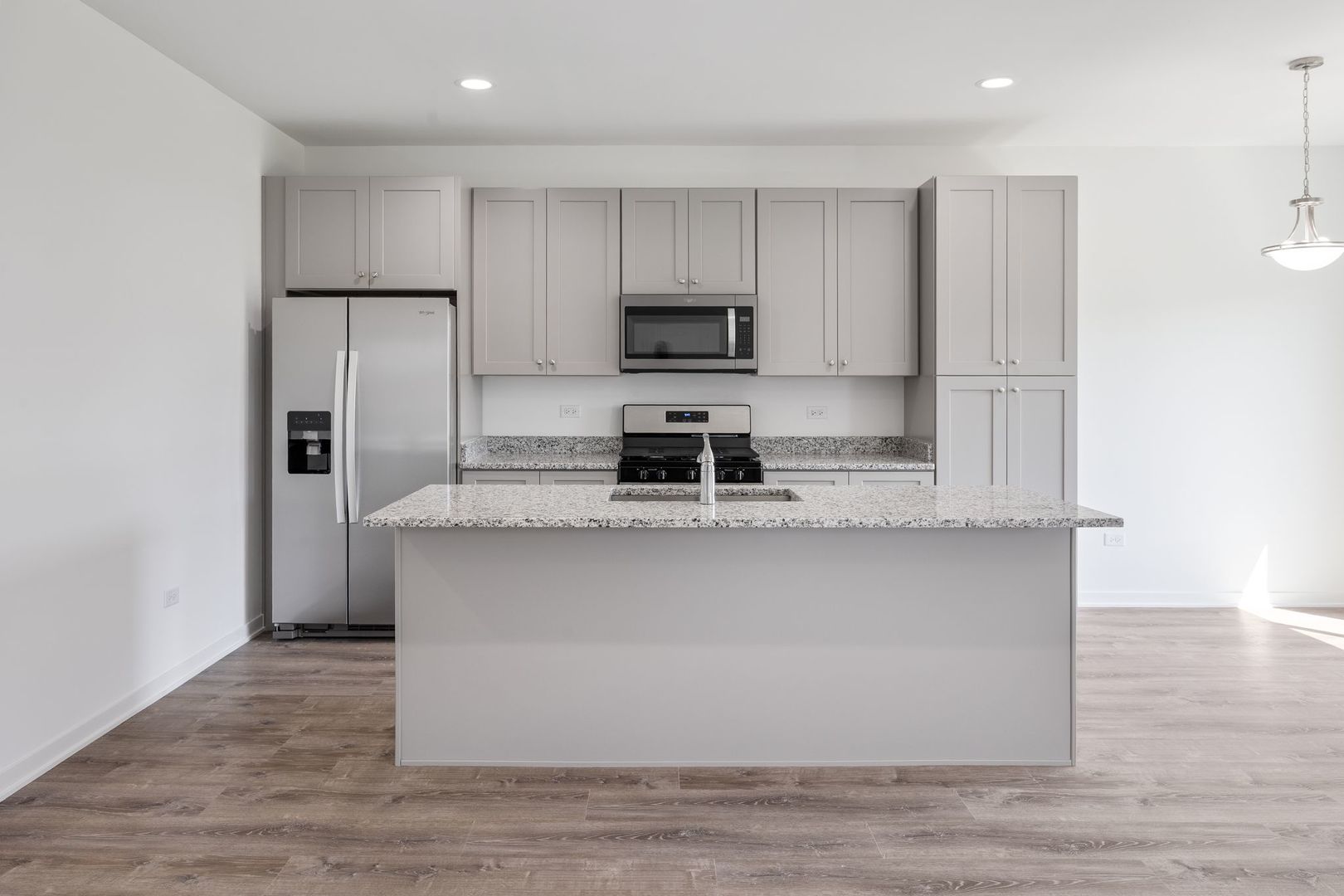1236 Gillespie Lane Yorkville, IL 60560 - Photo 2 of 20 a kitchen with stainless steel appliances granite countertop a stove a sink and a refrigerator
