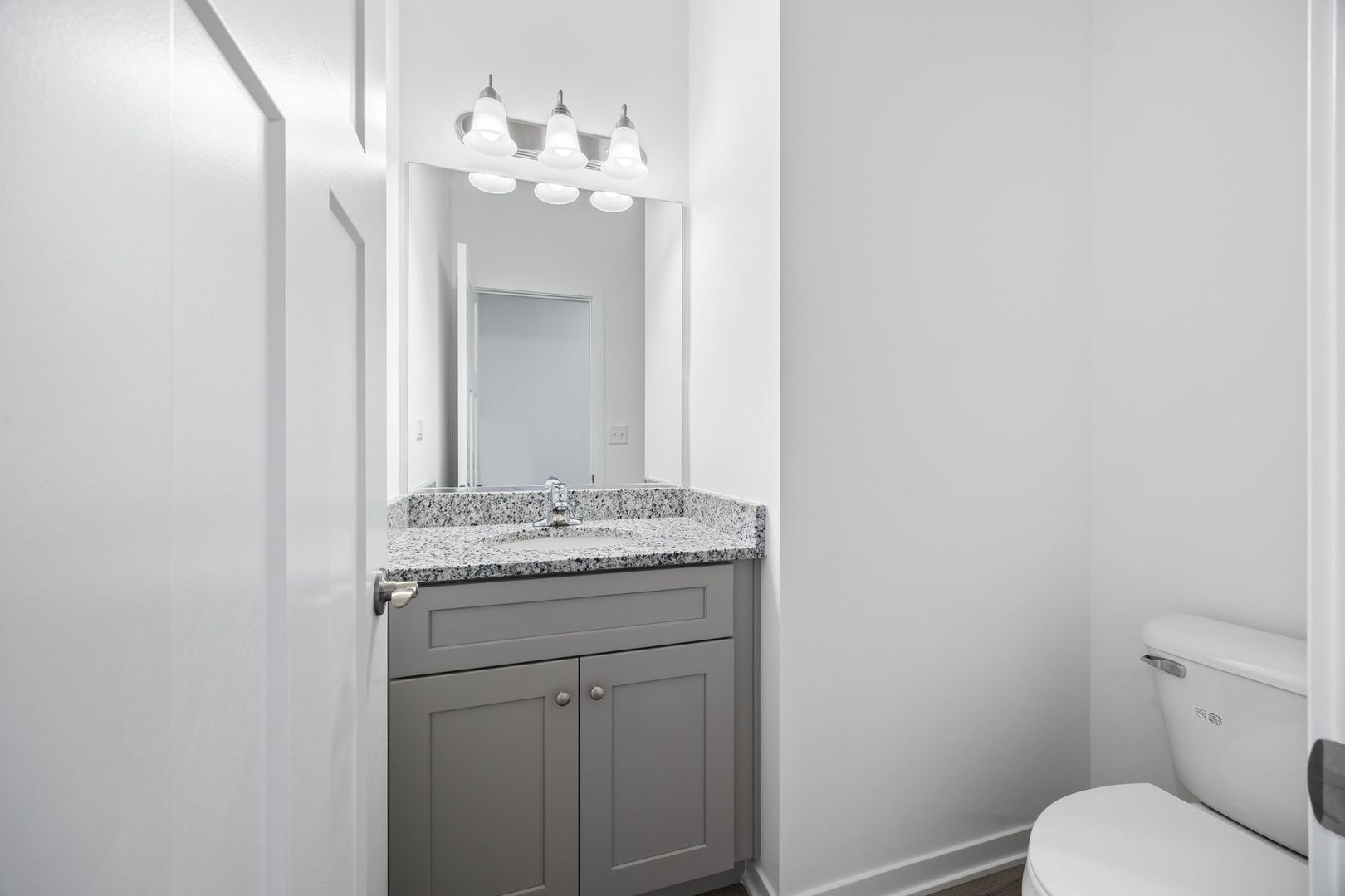 1236 Gillespie Lane Yorkville, IL 60560 - Photo 8 of 20 a bathroom with a granite countertop sink a toilet and a mirror