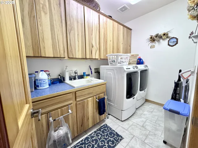 a view of a kitchen with appliances and cabinets