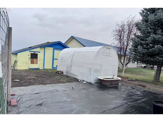 a view of outdoor space and backyard