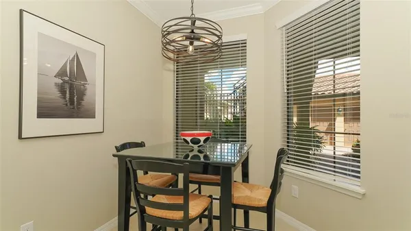 a bathroom with a granite countertop sink a toilet and a mirror