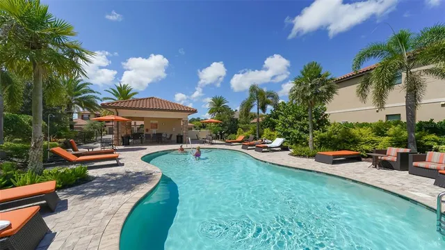 a view of a swimming pool with a patio