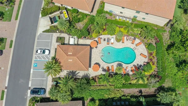a view of group of people sitting in front of retail shops