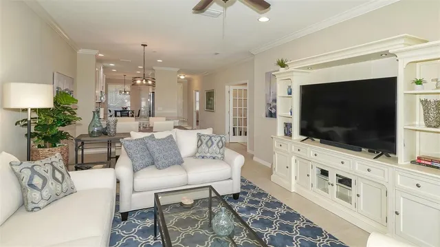 a view of a dining room with furniture and a chandelier
