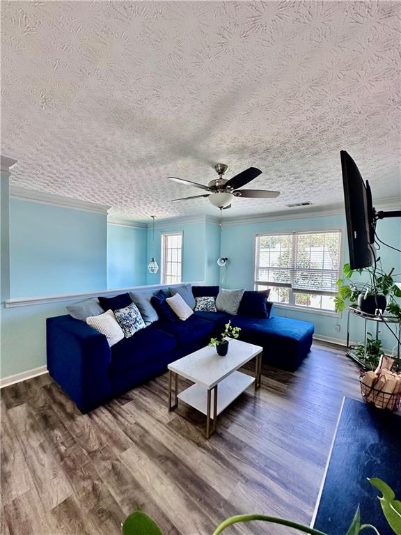 1591 Marceau Drive Conley, GA 30288 - Photo 12 of 47 a living room with furniture a rug and a large window