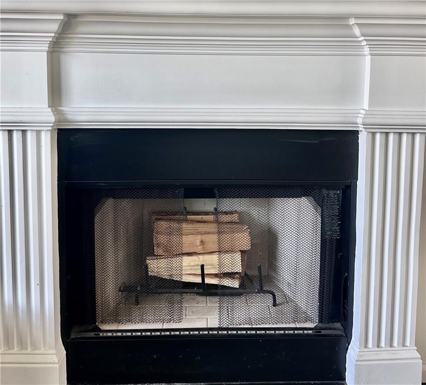 1591 Marceau Drive Conley, GA 30288 - Photo 14 of 47 a living room with a fireplace in it