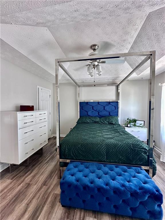 1591 Marceau Drive Conley, GA 30288 - Photo 30 of 47 a bedroom with a large bed and a dresser