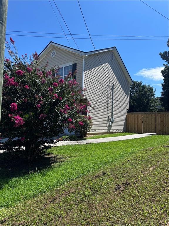 1591 Marceau Drive Conley, GA 30288 - Photo 3 of 47 a front view of a house with a garden
