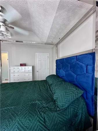 a living room with a couch and dresser