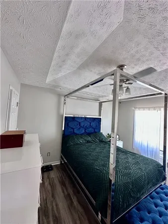 a bedroom with a bed and window