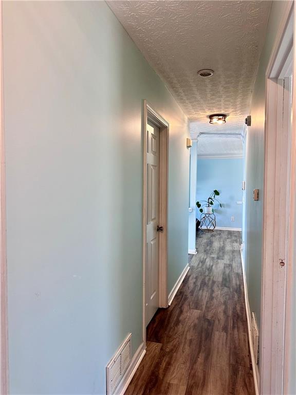 1591 Marceau Drive Conley, GA 30288 - Photo 36 of 47 a view of a hallway view with wooden floor and staircase