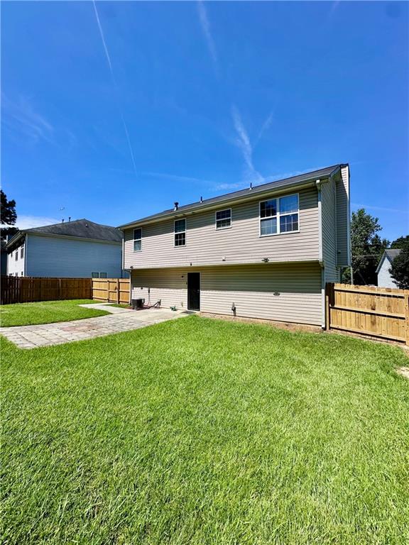 1591 Marceau Drive Conley, GA 30288 - Photo 44 of 47 a front view of a house with a yard