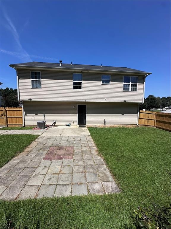 1591 Marceau Drive Conley, GA 30288 - Photo 47 of 47 a front view of a house with a yard