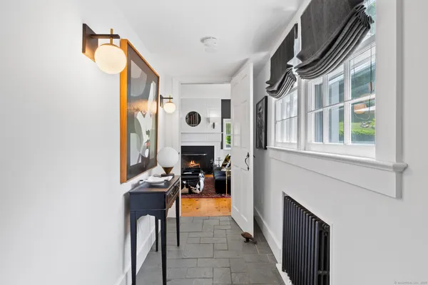 a view of living room with furniture and a window