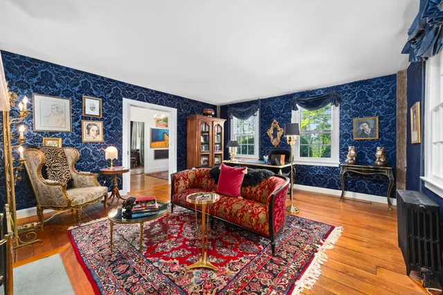 a living room with furniture and a rug