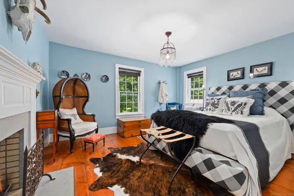 a living room with furniture a rug and a window