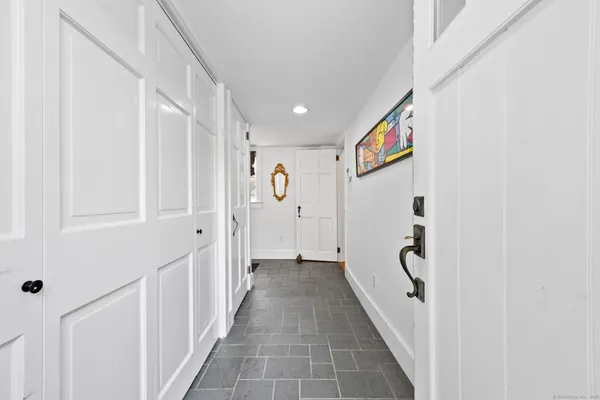 a view of a hallway with white walls