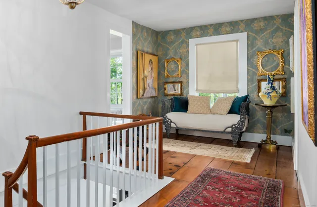 a living room with furniture and a rug