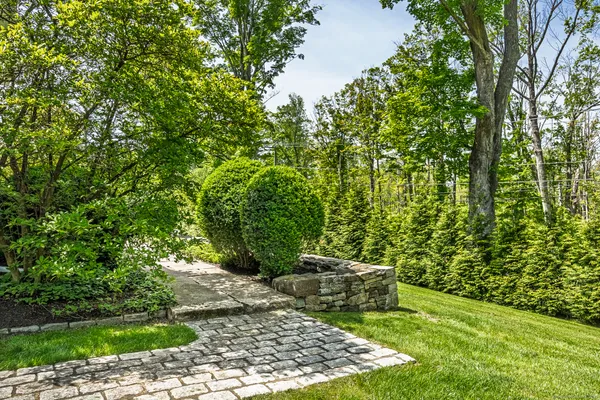 a view of a backyard with sitting area