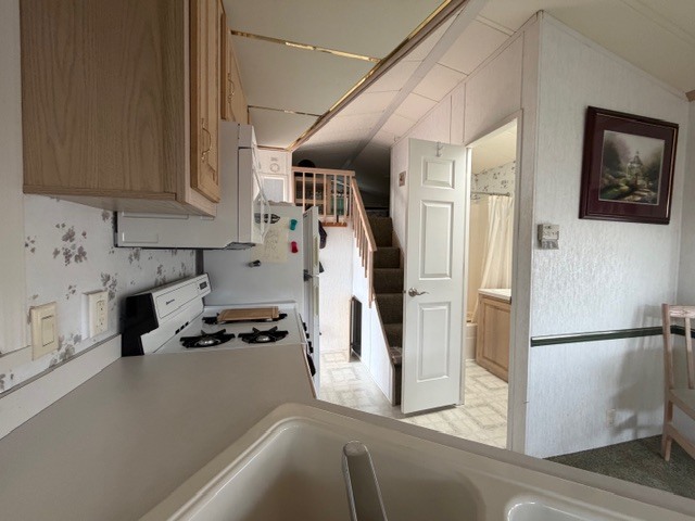 2795 East 28th Road Marseilles, IL 61341 - Photo 14 of 64 a kitchen with stainless steel appliances a refrigerator a stove a sink and white cabinets with wooden floor