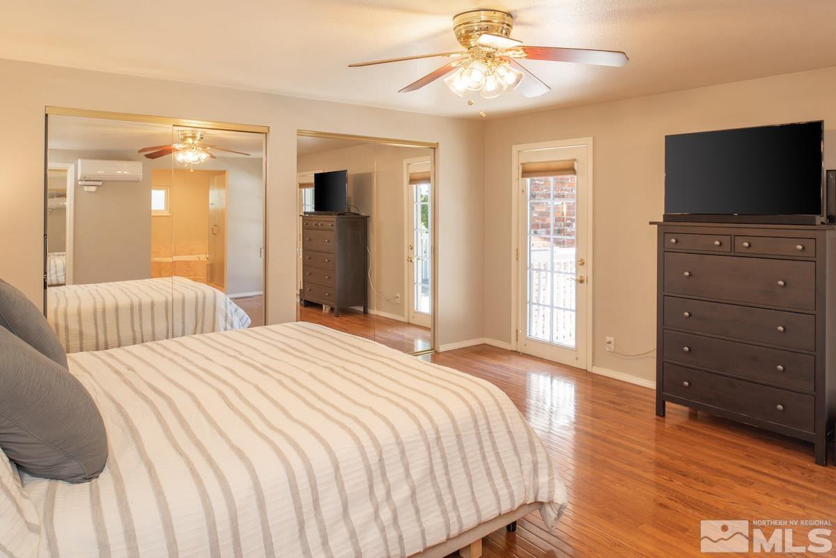 2000 Dant Boulevard Reno, NV 89509 - Photo 11 of 40 a bedroom with a bed and a flat screen tv