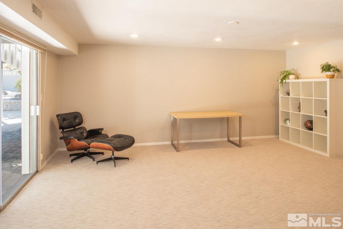 2000 Dant Boulevard Reno, NV 89509 - Photo 17 of 40 a living room with furniture a rug and a window
