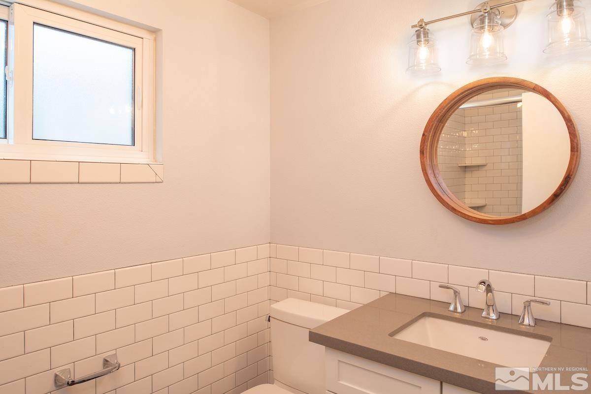 2000 Dant Boulevard Reno, NV 89509 - Photo 20 of 40 a bathroom with a sink a toilet and a mirror