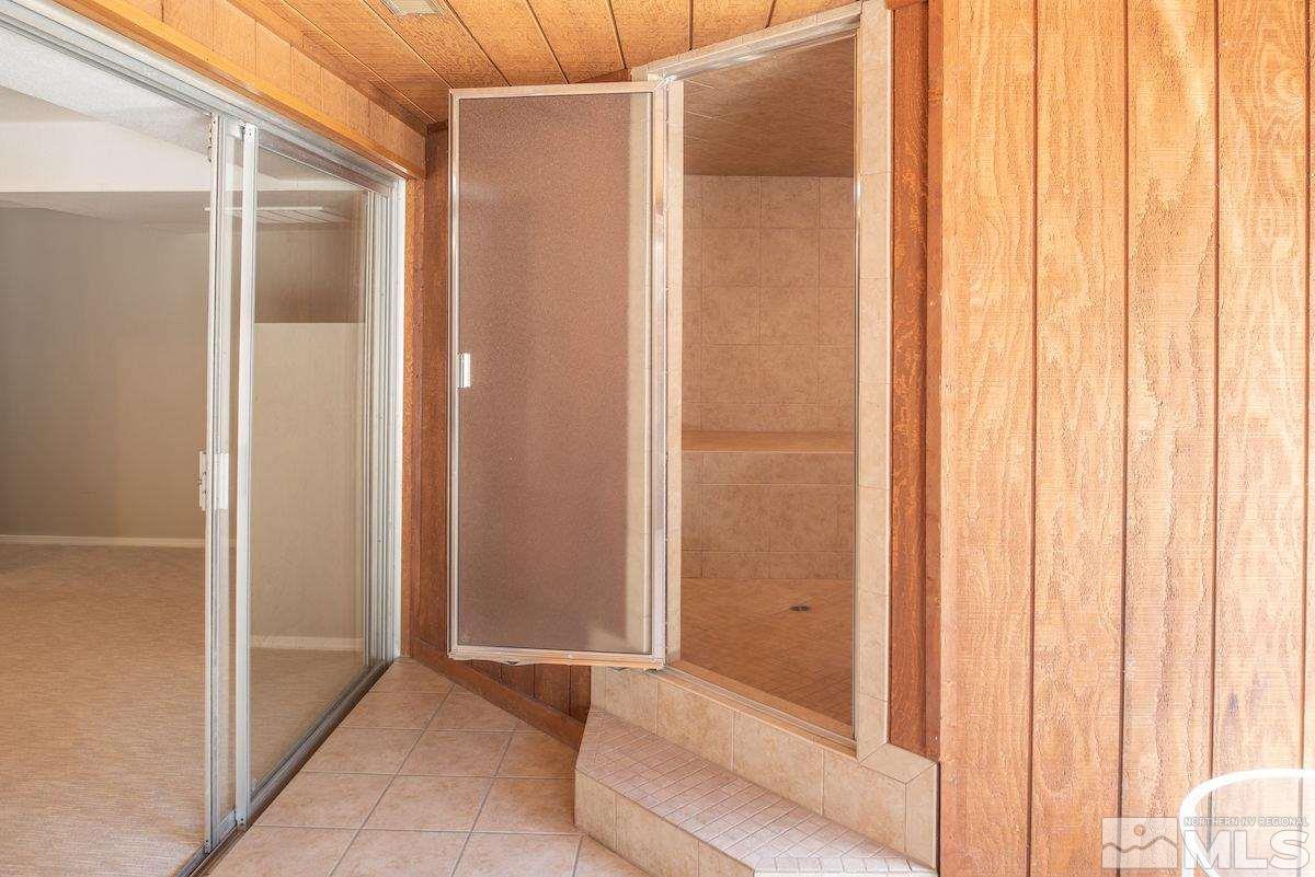 2000 Dant Boulevard Reno, NV 89509 - Photo 21 of 40 a bathroom with a shower and a glass door