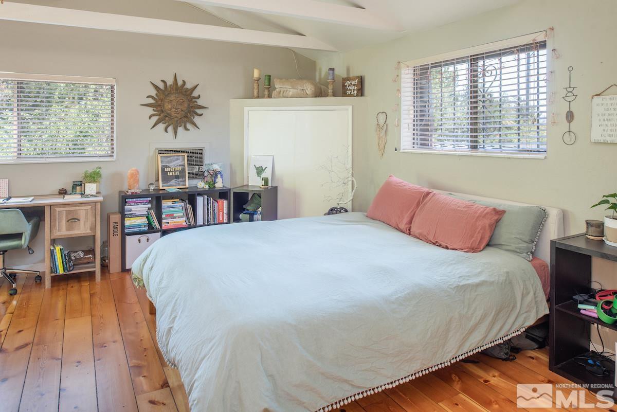 2000 Dant Boulevard Reno, NV 89509 - Photo 24 of 40 a bedroom with a bed and wooden floor
