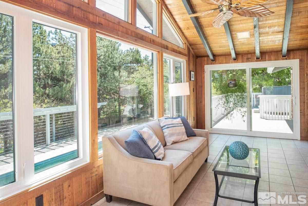 2000 Dant Boulevard Reno, NV 89509 - Photo 3 of 40 a living room with furniture and floor to ceiling windows