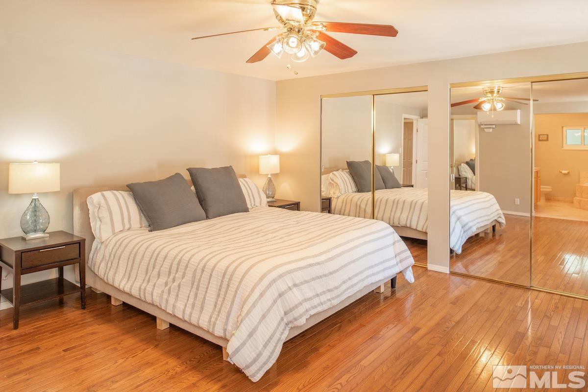 2000 Dant Boulevard Reno, NV 89509 - Photo 10 of 40 a bedroom with a bed and a chandelier